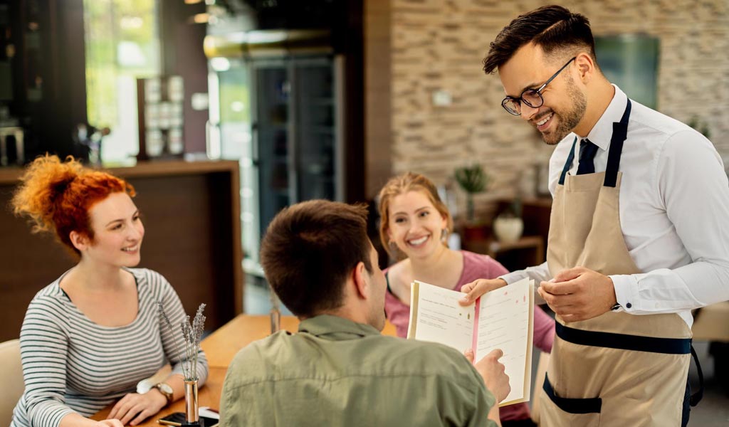 restaurant staff providing customer service in restaurants hospitality setting