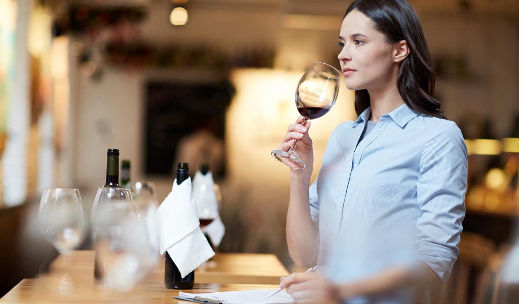 waiter smelling wine